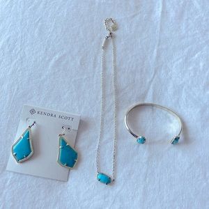 Kendra Scott necklace, earrings and cuff bracelet in blue and gold